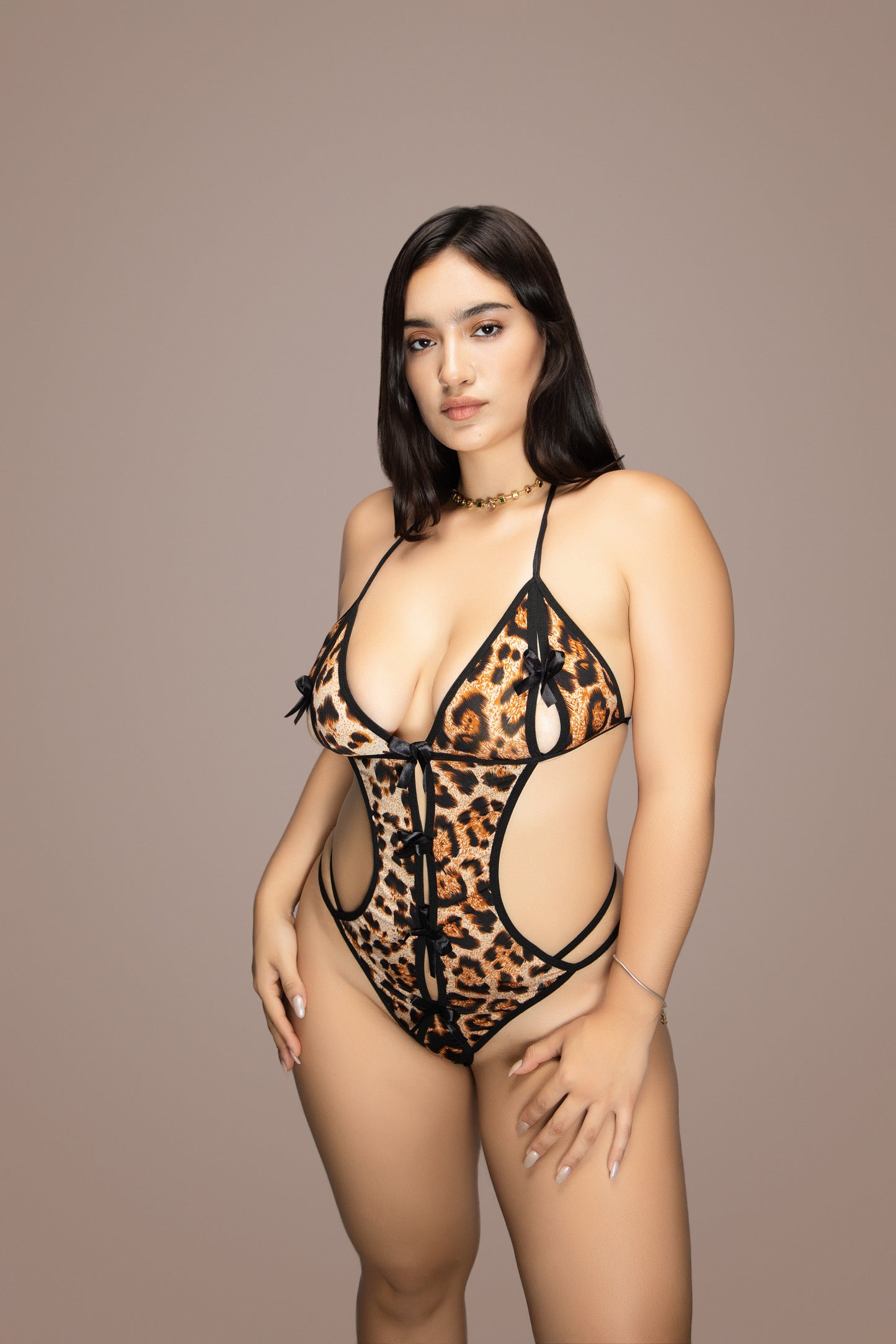 Body teddy de leopardo con abertura ribete unido con tanga